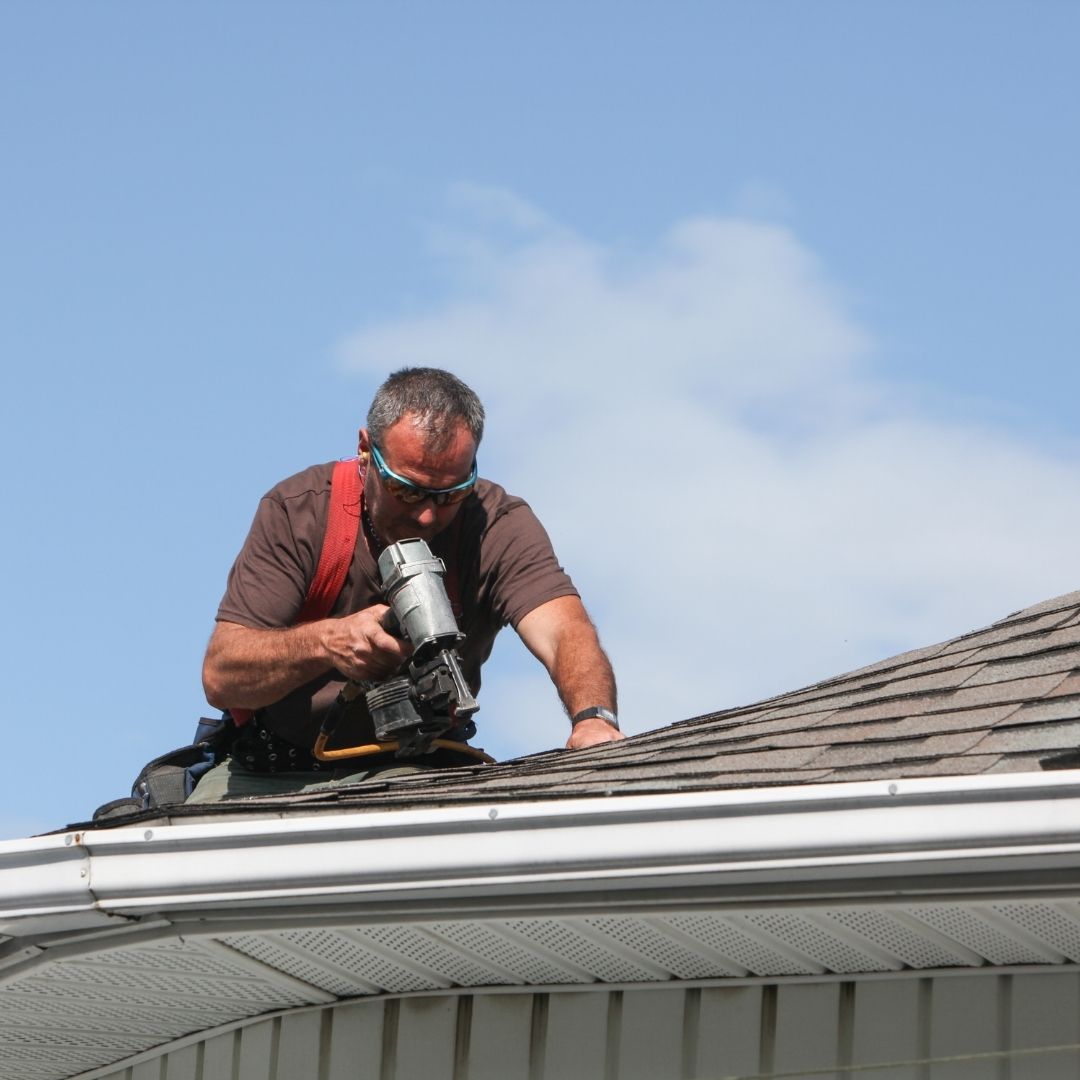 How do you remove moss and debris from roofs?
